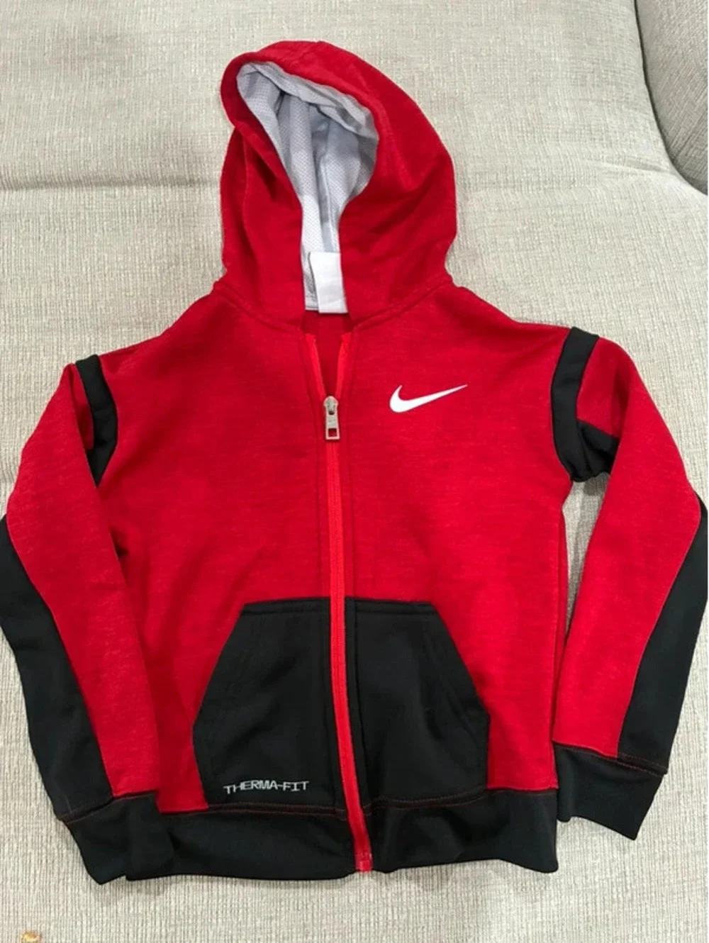 Nike red and black kids zip up hoodie with white swoosh